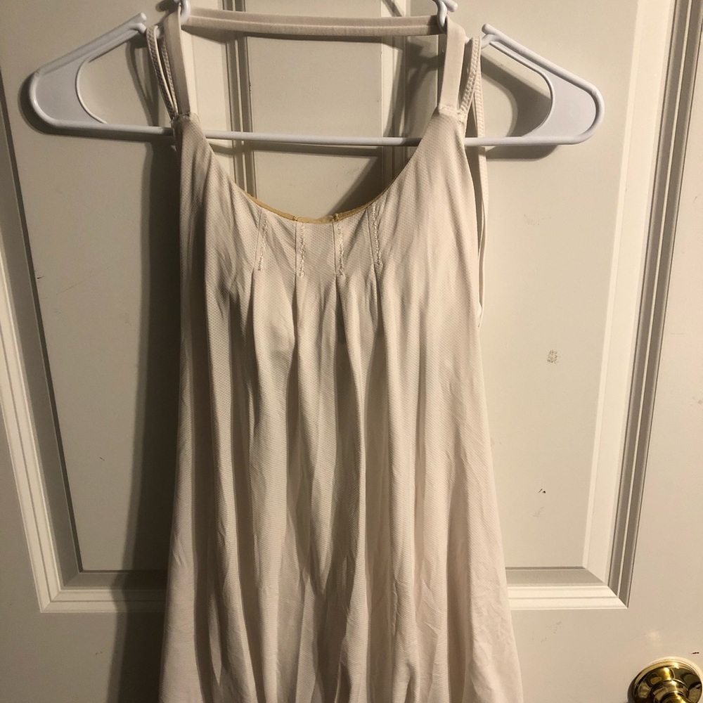 White strappy lululemon tank top with built-in bra